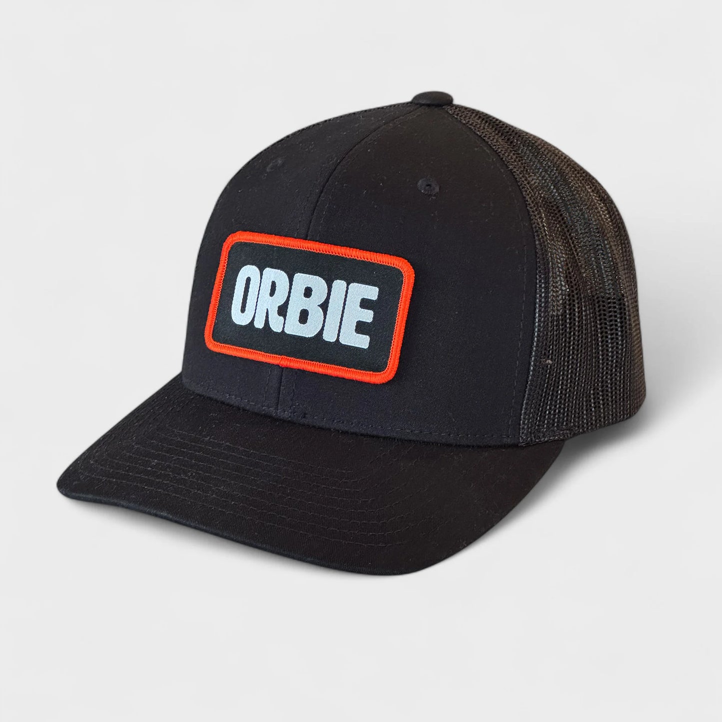Orbie Badge Logo Trucker Hat - Black